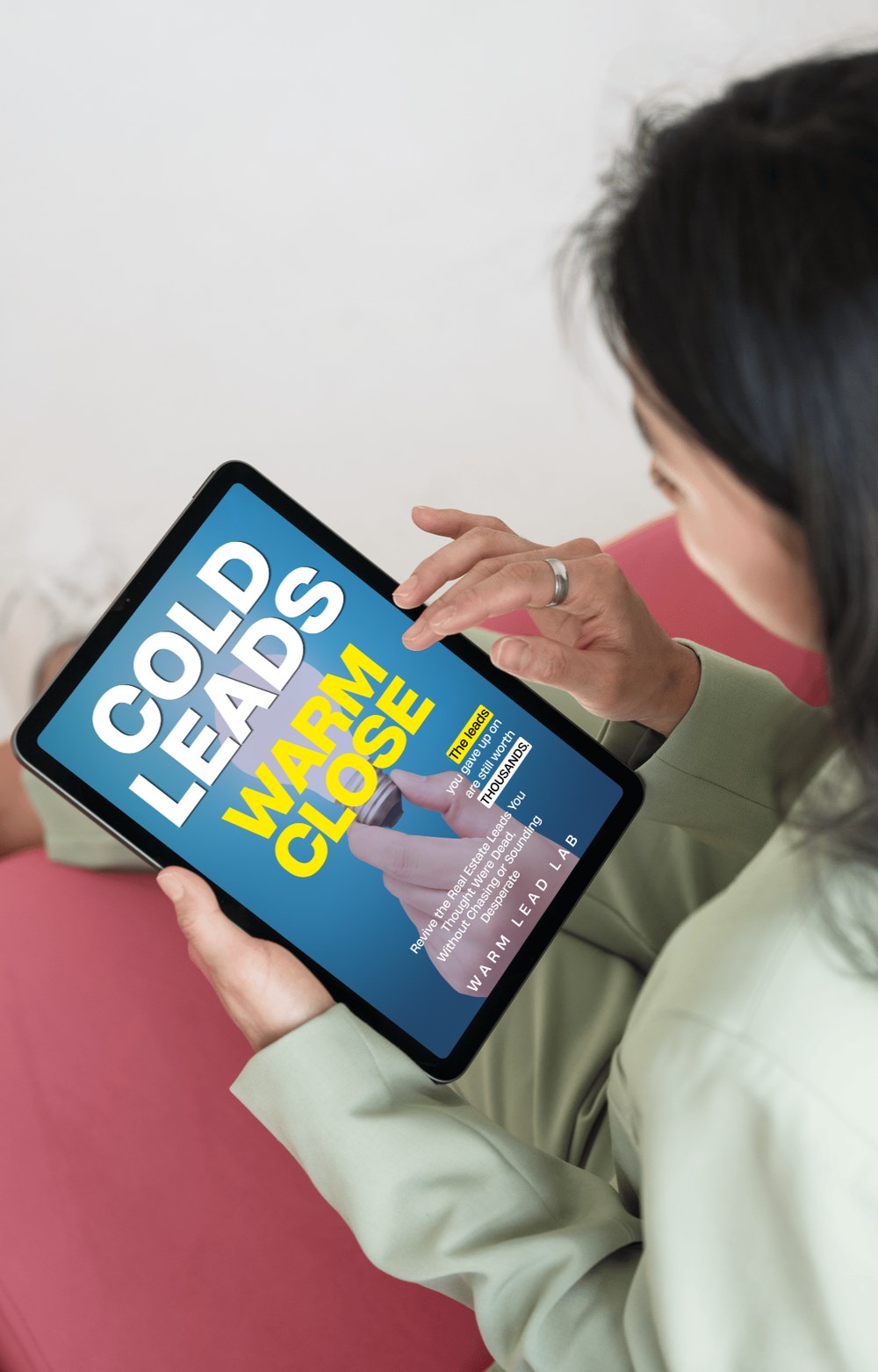 Agent reading Cold Leads, Warm Close on a tablet